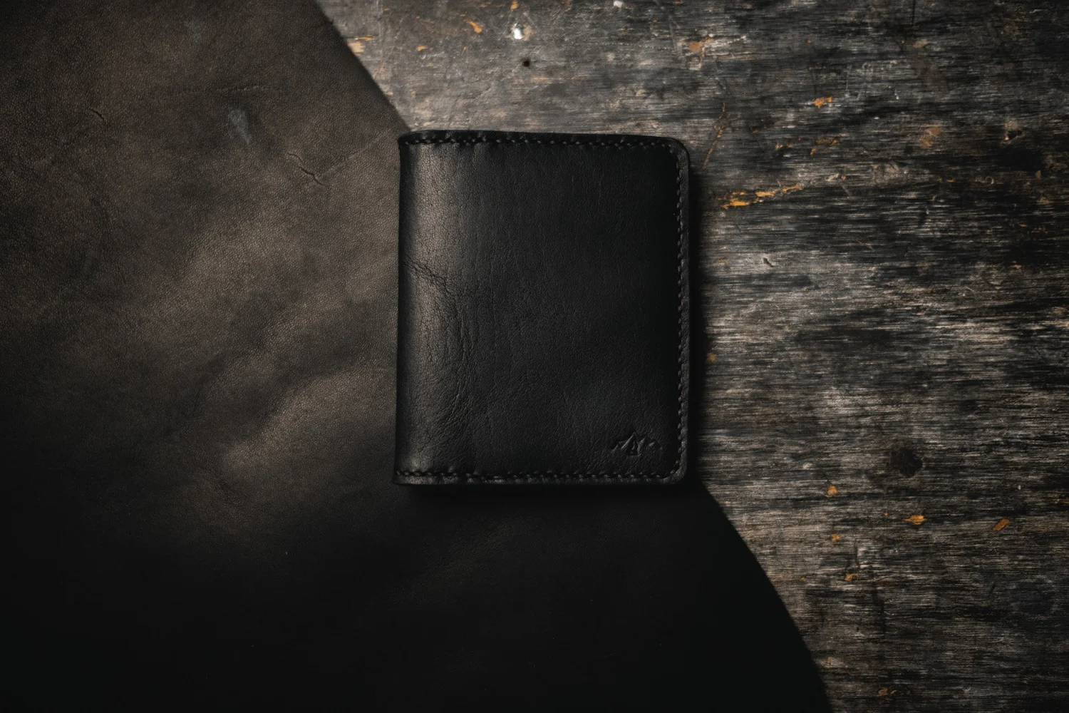 The Blackout bi-fold wallet, scuffed and broken in