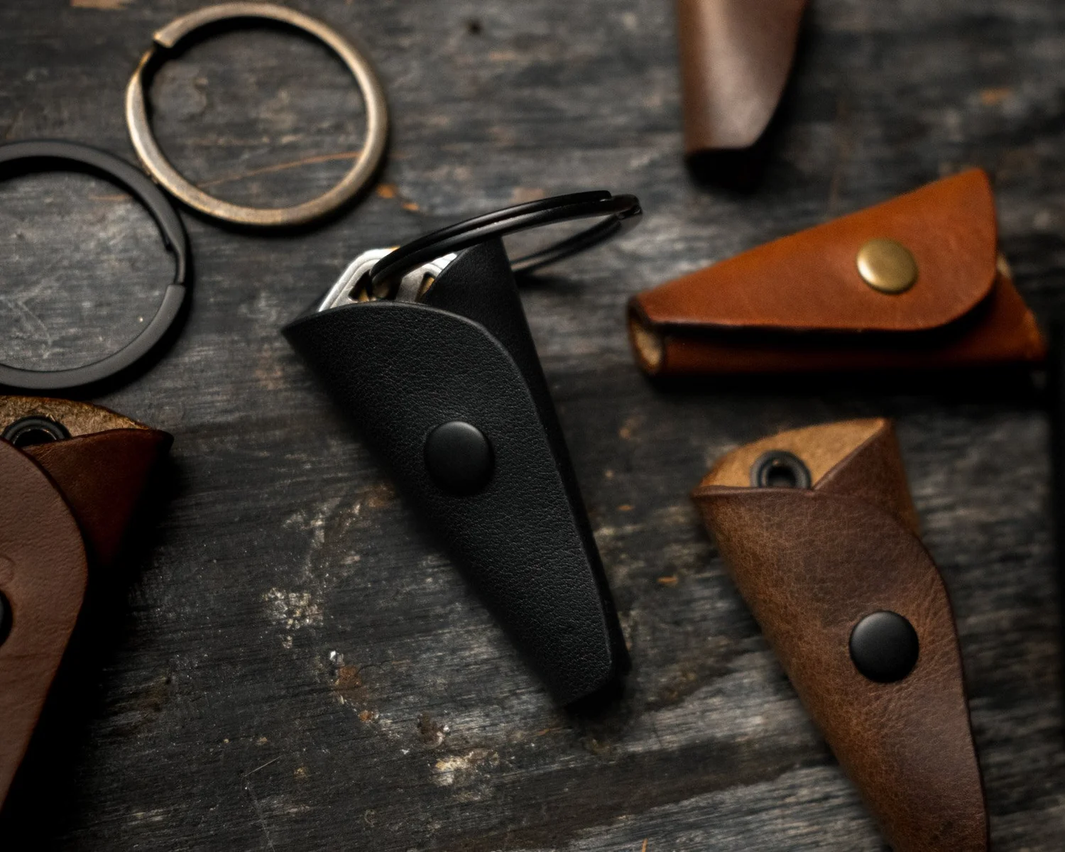 Black leather key wrap holding a ring of keys
