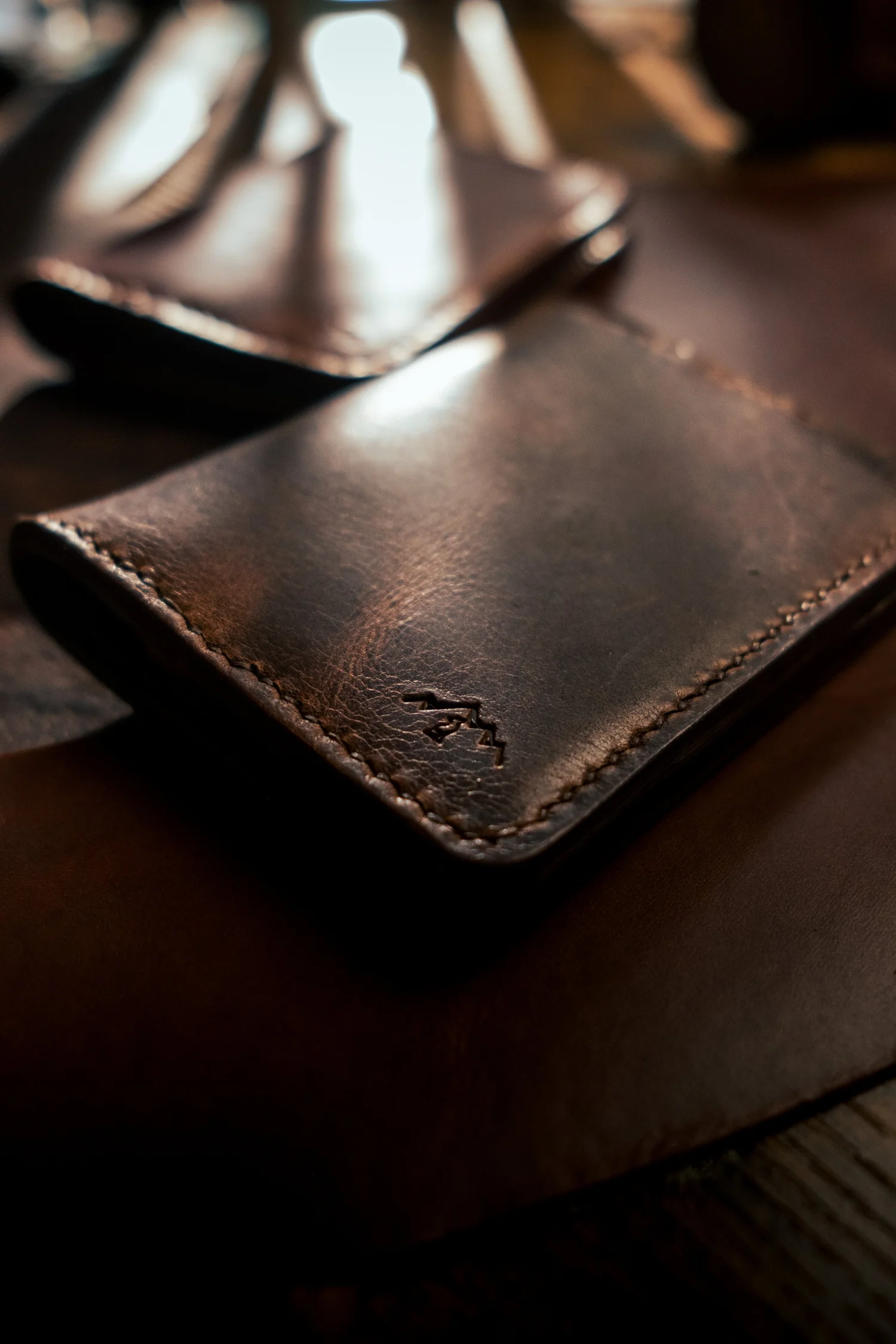 The Mountain Brown bi-fold wallet in deep brown full-grain leather